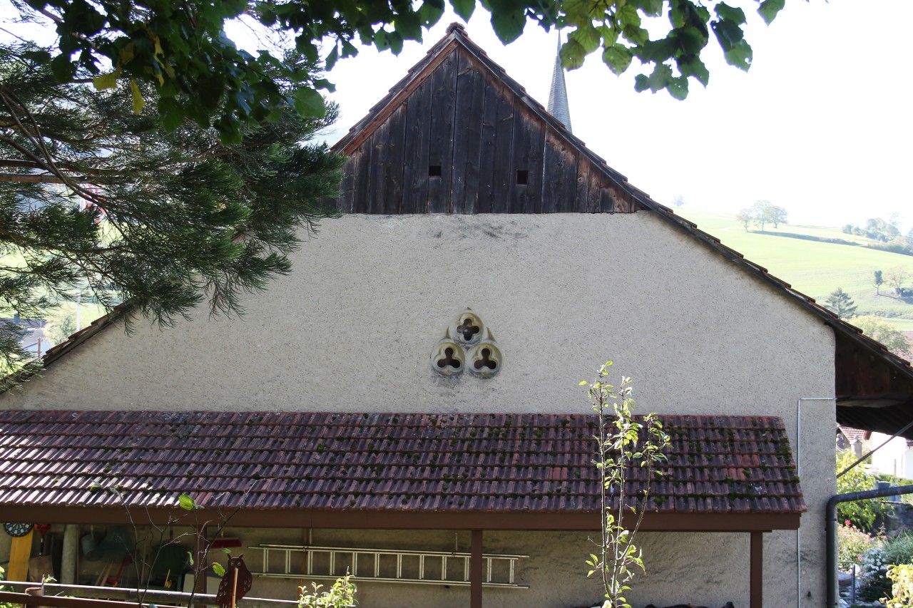 Masswerkfragment als Lüftungsöffnung an der Stirnseite des Hauses Kirchgasse 18 in Thalheim.