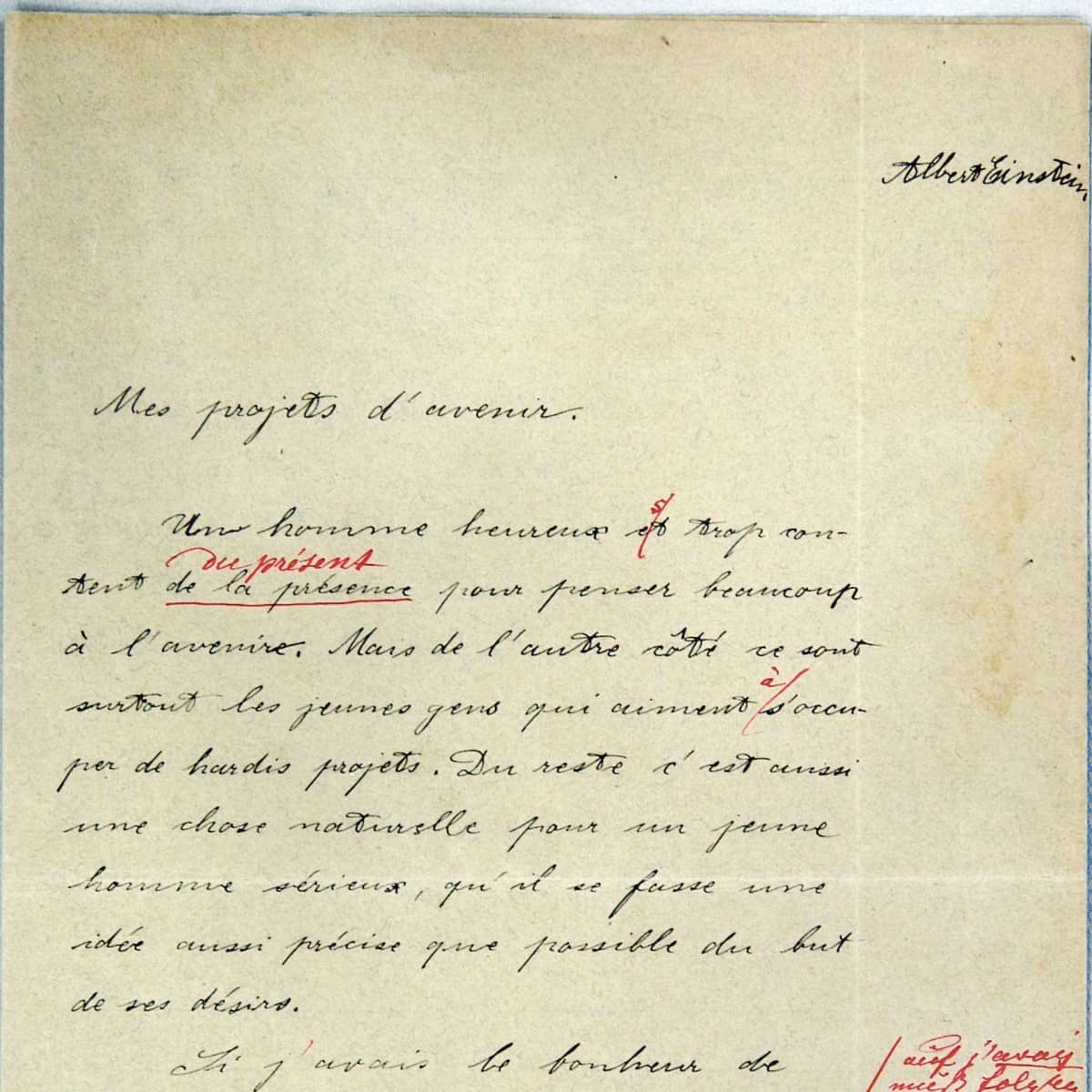 Französisch-Aufsatz mit Titel "Mes projets d’avenir" von Albert Einstein verfasst. Schwarze Schrift mit roten Korrekturen. 