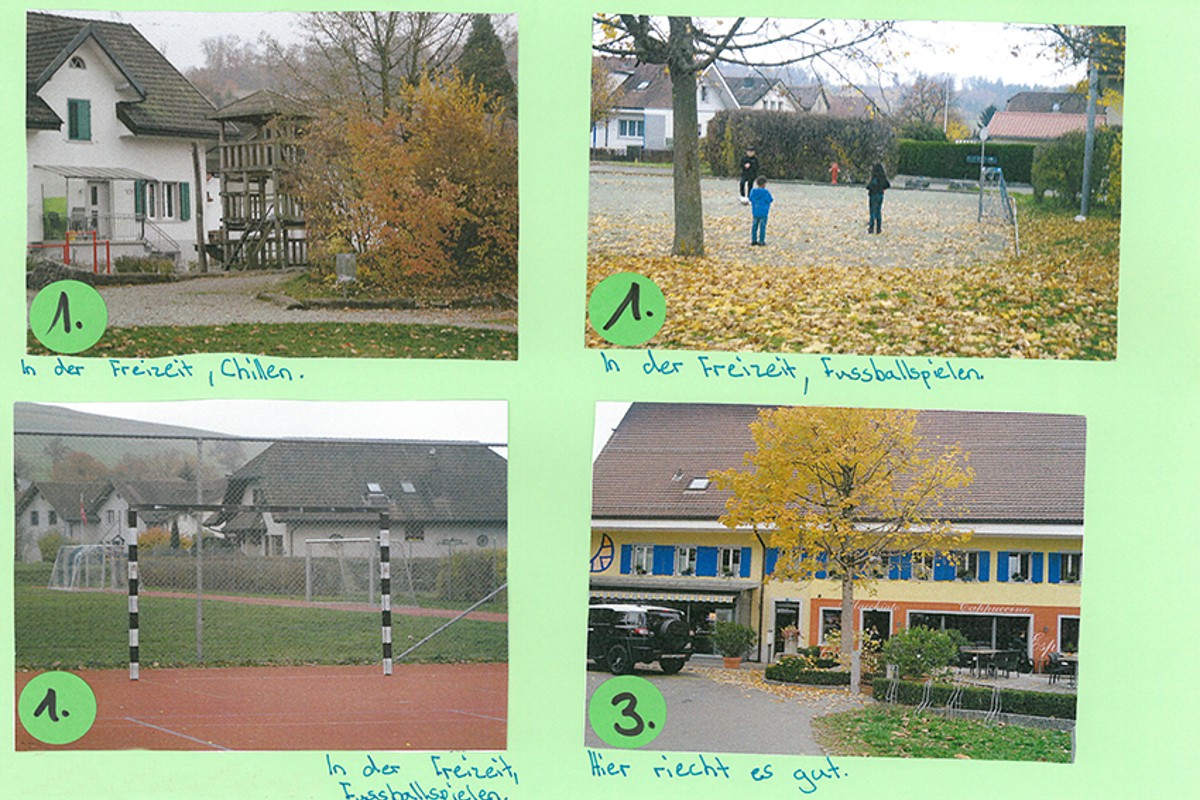 Papierblatt mit aufgeklebten Fotos von Lielingsorten der Schüler