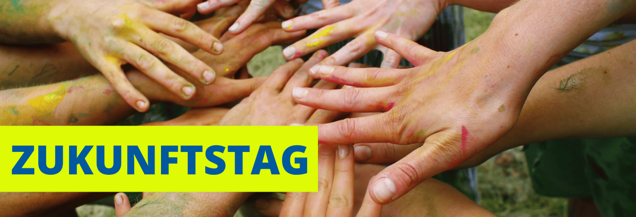 Bild mit farbigen Händen und ein Text Zukunftstag als Symbolbild.