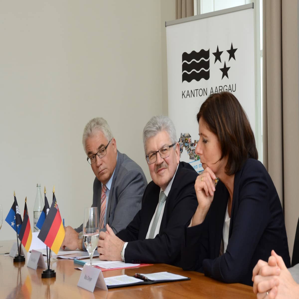 Portrait des Regierungssprechers Buri, Landammann Brogli und Ministerpräsidentin Dreyer